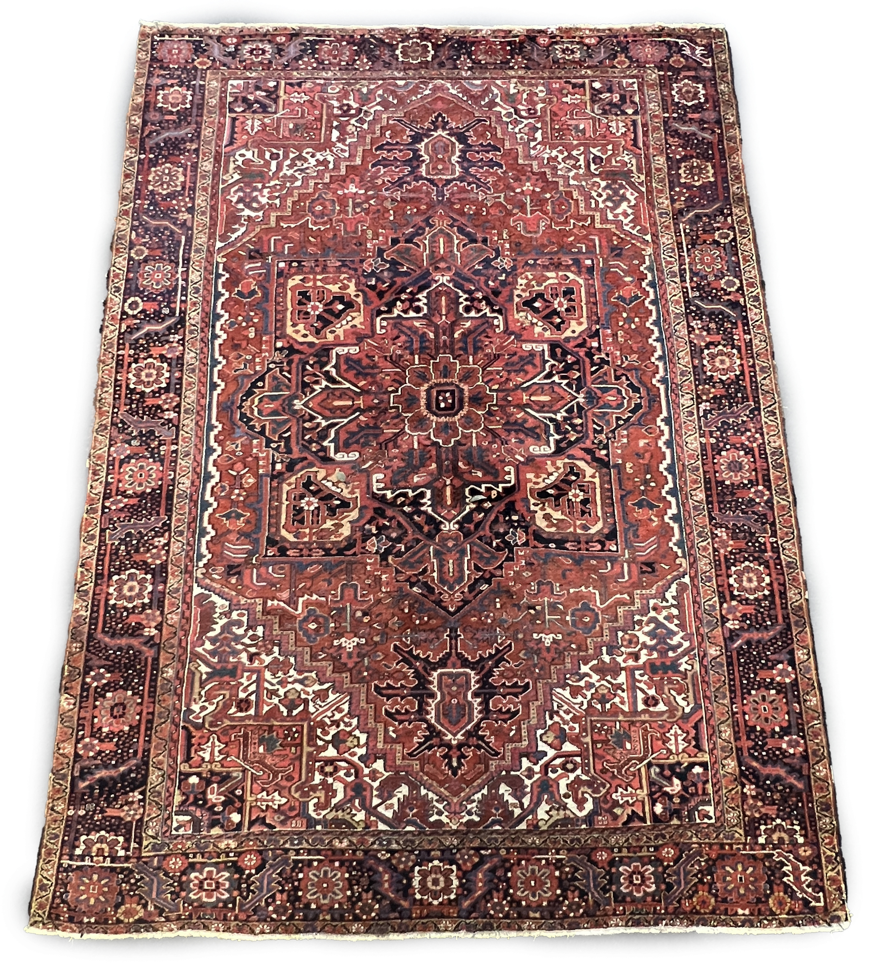 An antique Heriz carpet, 410 x 295cm